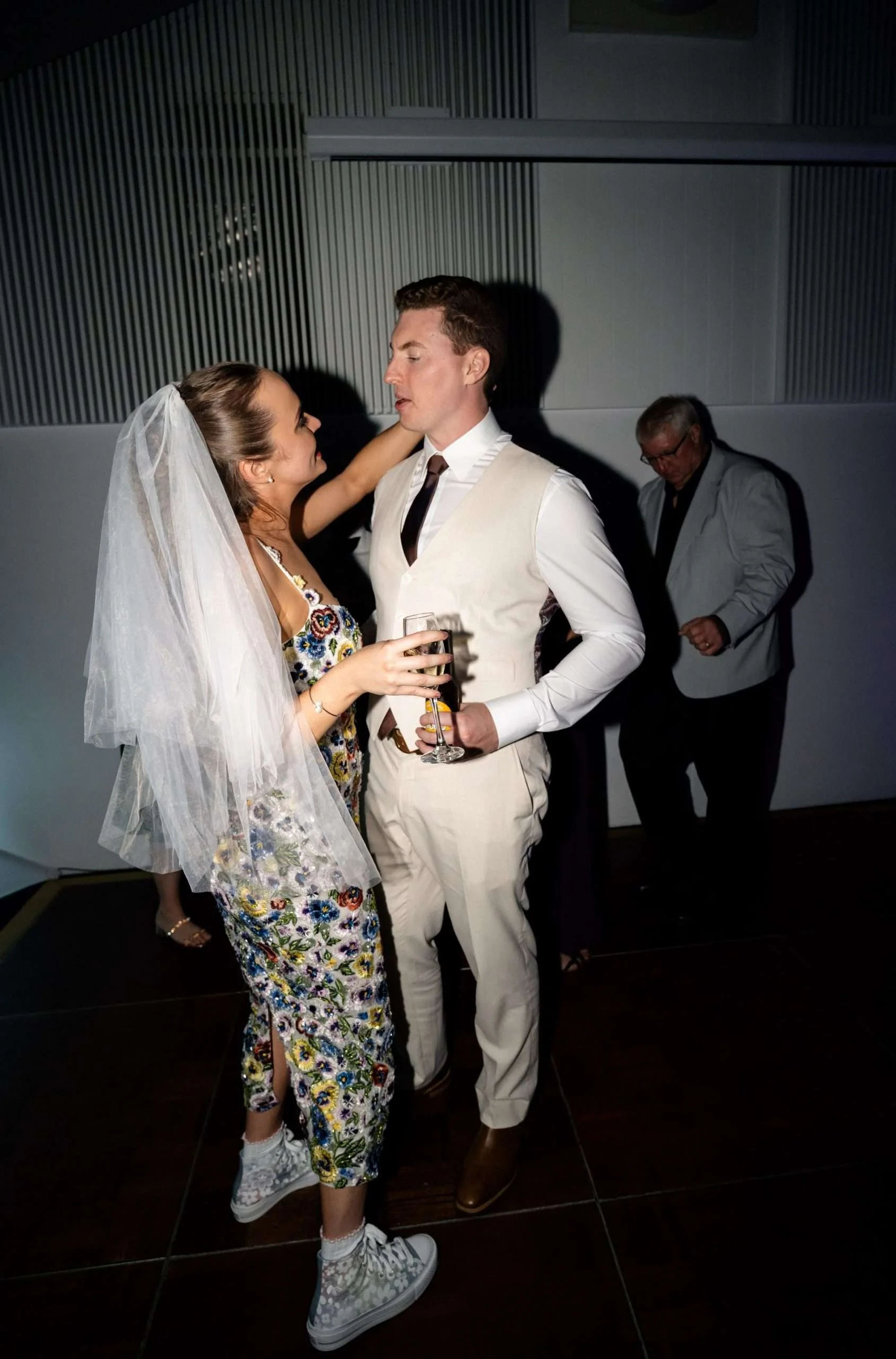 bride and groom dancing in dance floor while look at each other