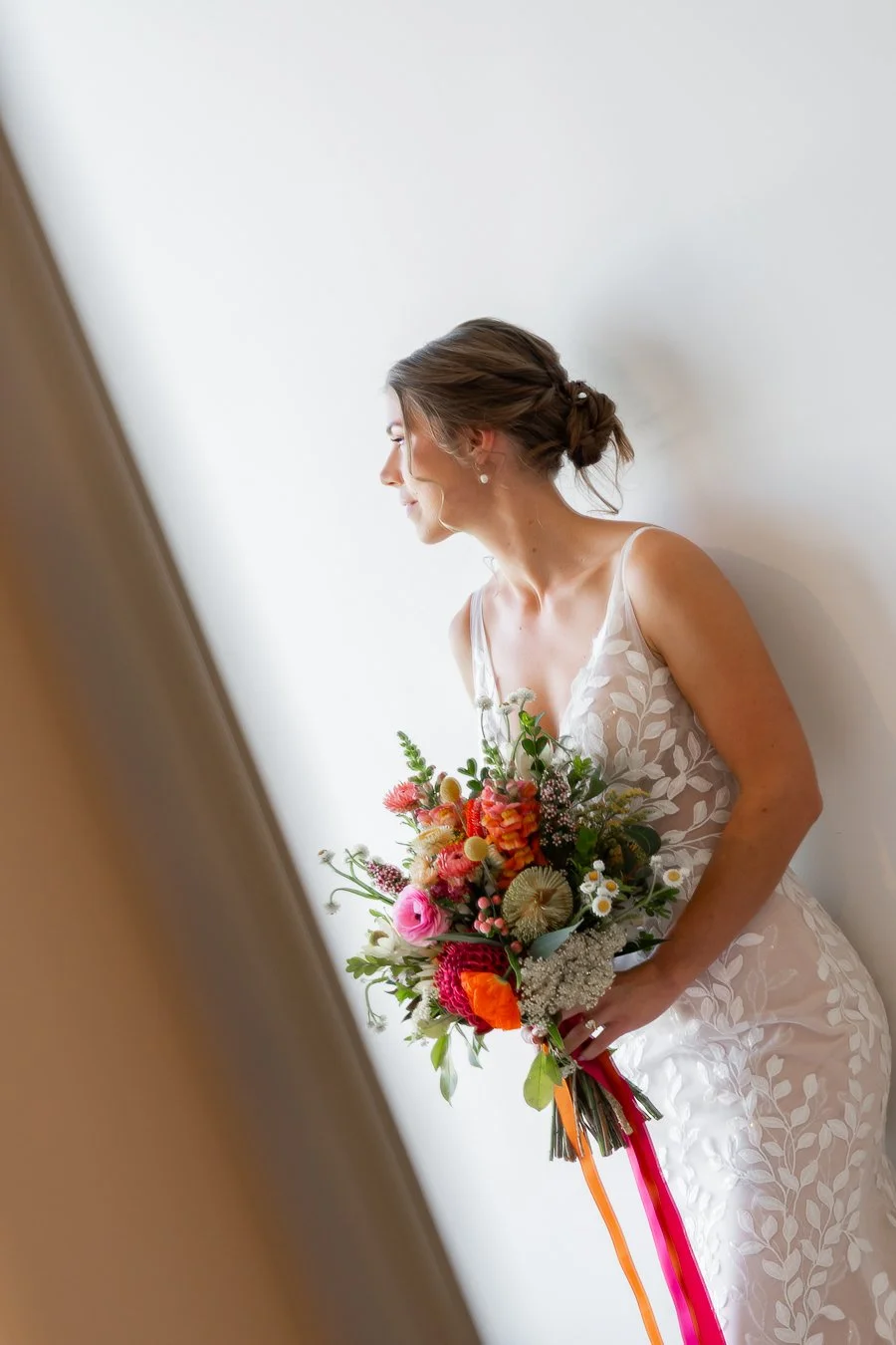 The bride looked toward the windowsill.