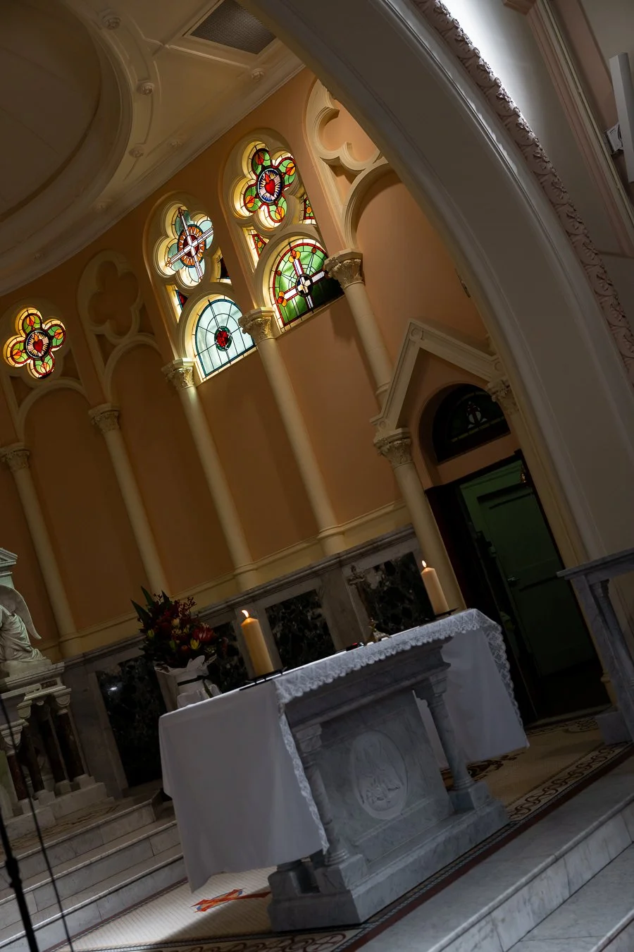 The church’s stained glass windows and altar