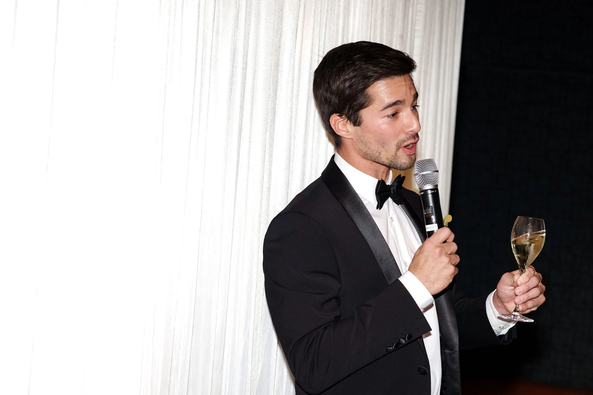 groom Cliffe's batsman holding a glass making a speach
