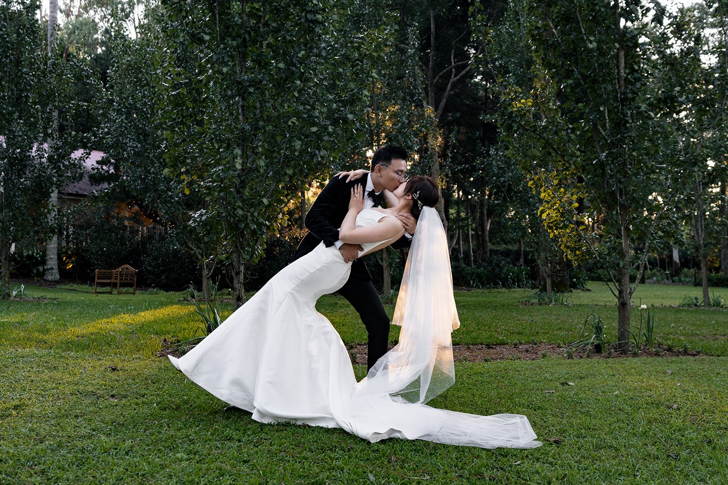 groom kissing bride Vicky when dipping her in gabbinbar homestead