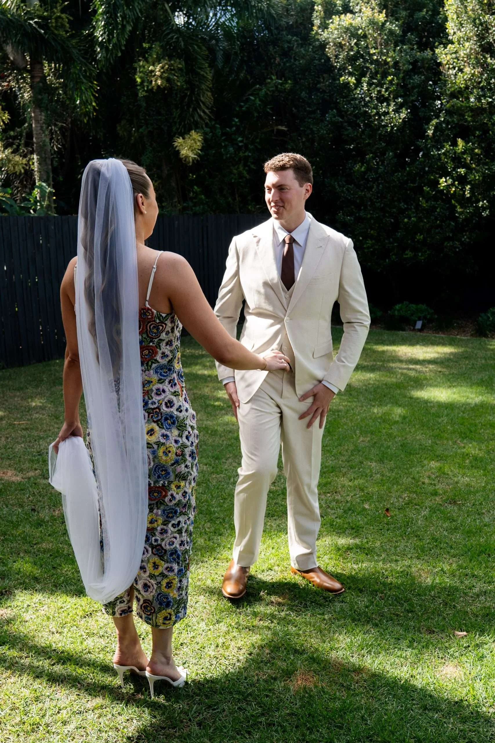 Groom Jack showing his first impression soft smile to bride Charlotte during their first look.