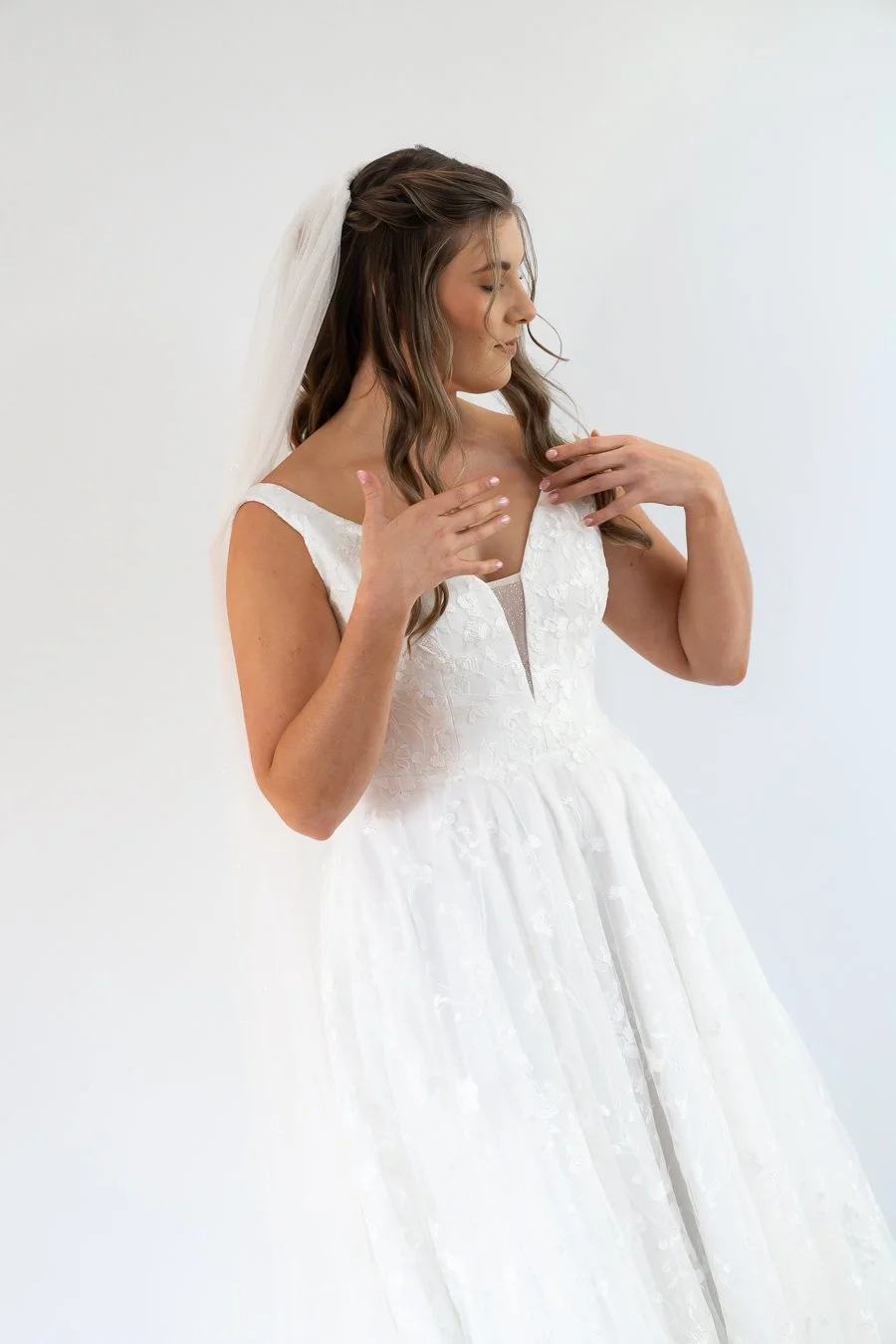 bride Chiarra two hand try to pull back her hair