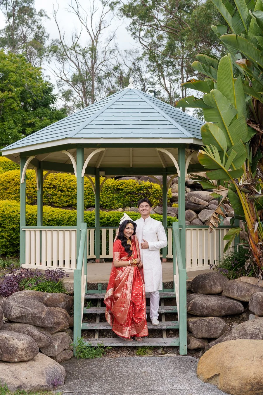 Casey standing in a second last stair and Amrita stand in the first stair and they both look at the Brisbane wedding photographer Whistler Li