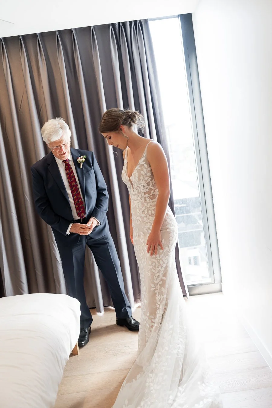 The bride twirled around to show her dress to her father