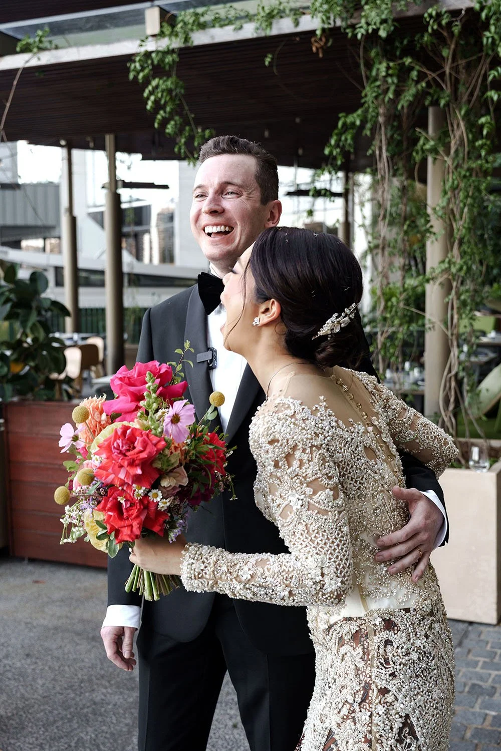 Nori big laughing while holding Cliffe