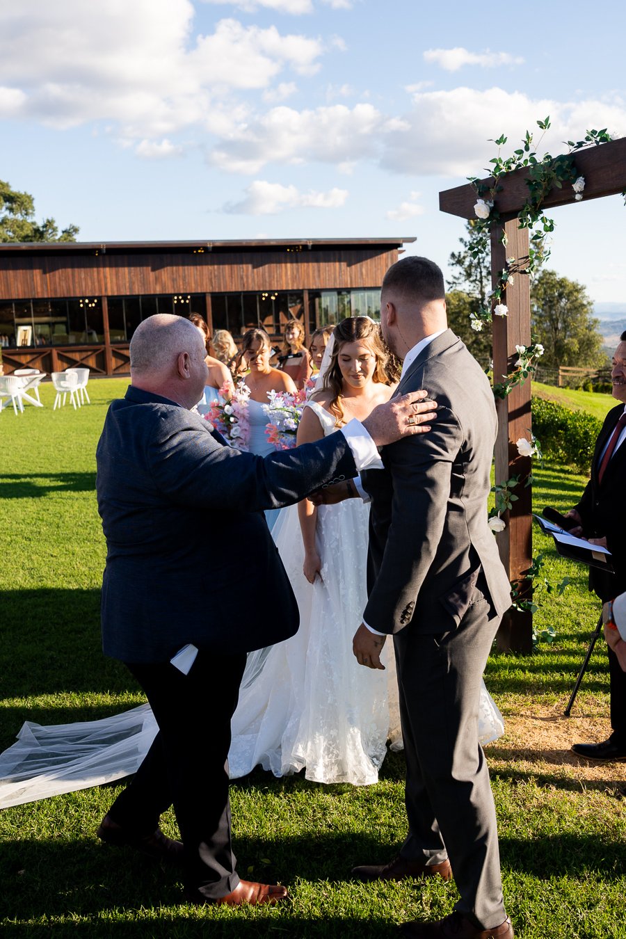 bride father touching Ben's shoulder hand over his daughter to him