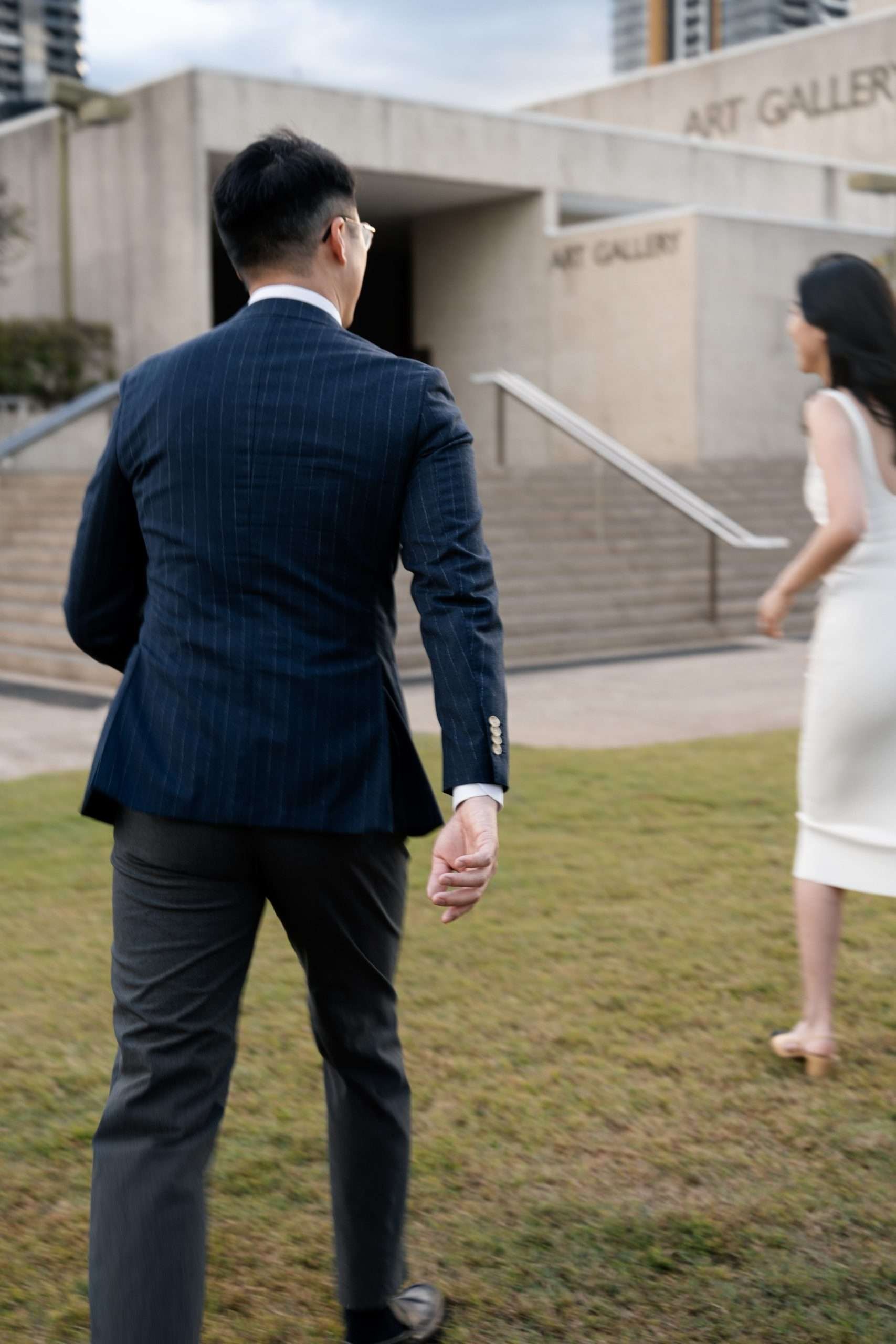 Dave running towards Kath, his excitement and love evident as he eagerly closes the distance between them, creating a joyful and dynamic moment.