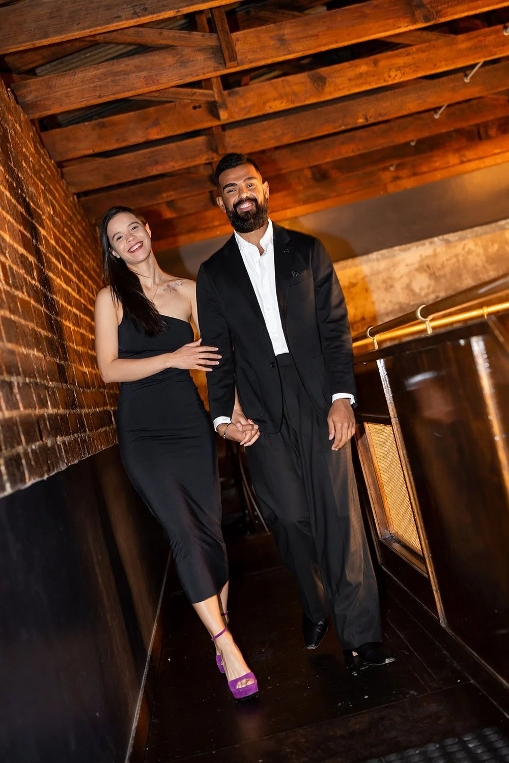 Jasmin hold Jay's hand walking towards to the Brisbane wedding photographer Whistler Li