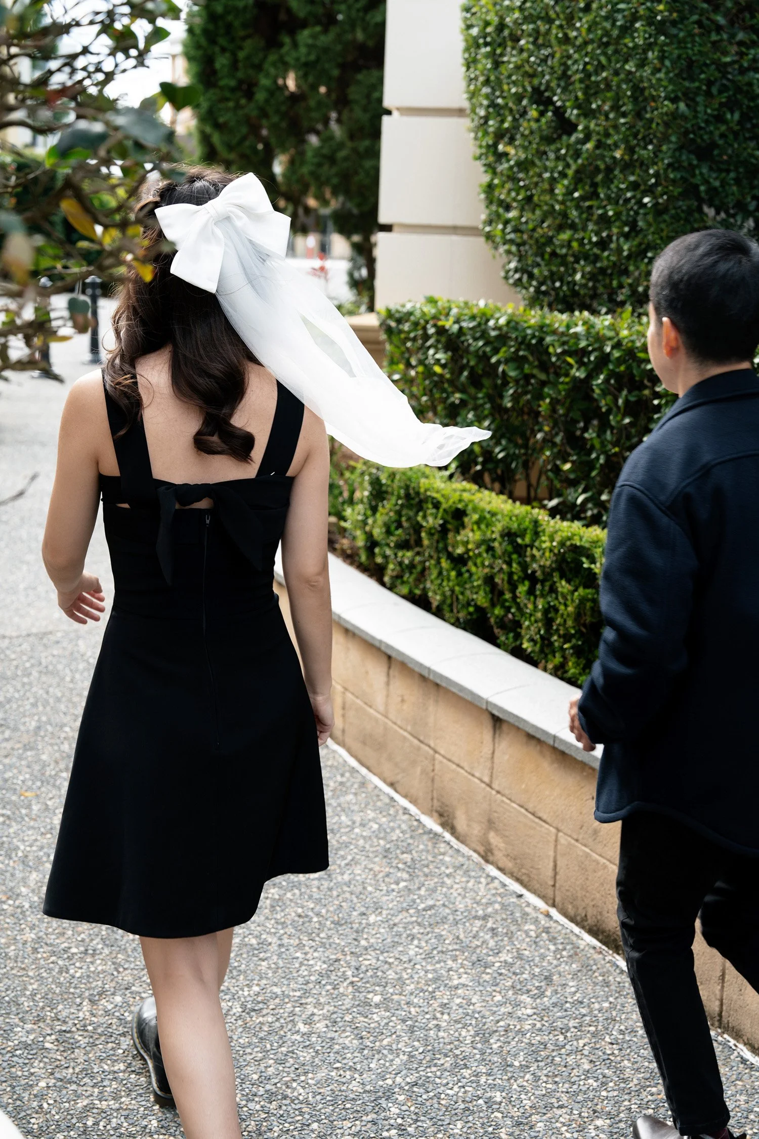 Paul and Krystel walking away form the camera in Emerald Lakes Village