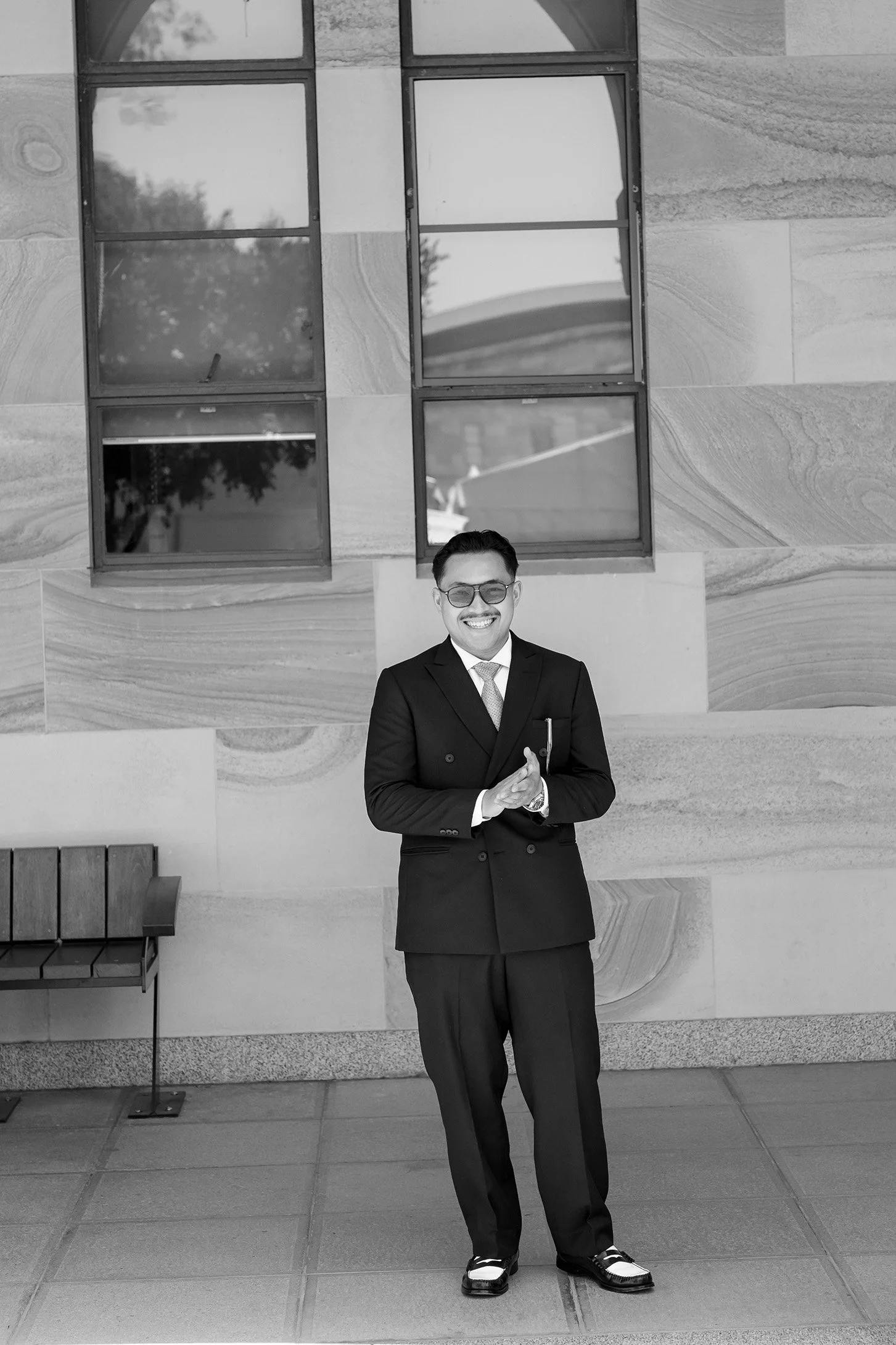 Aka rubbing his palms together while smiling at the photographer