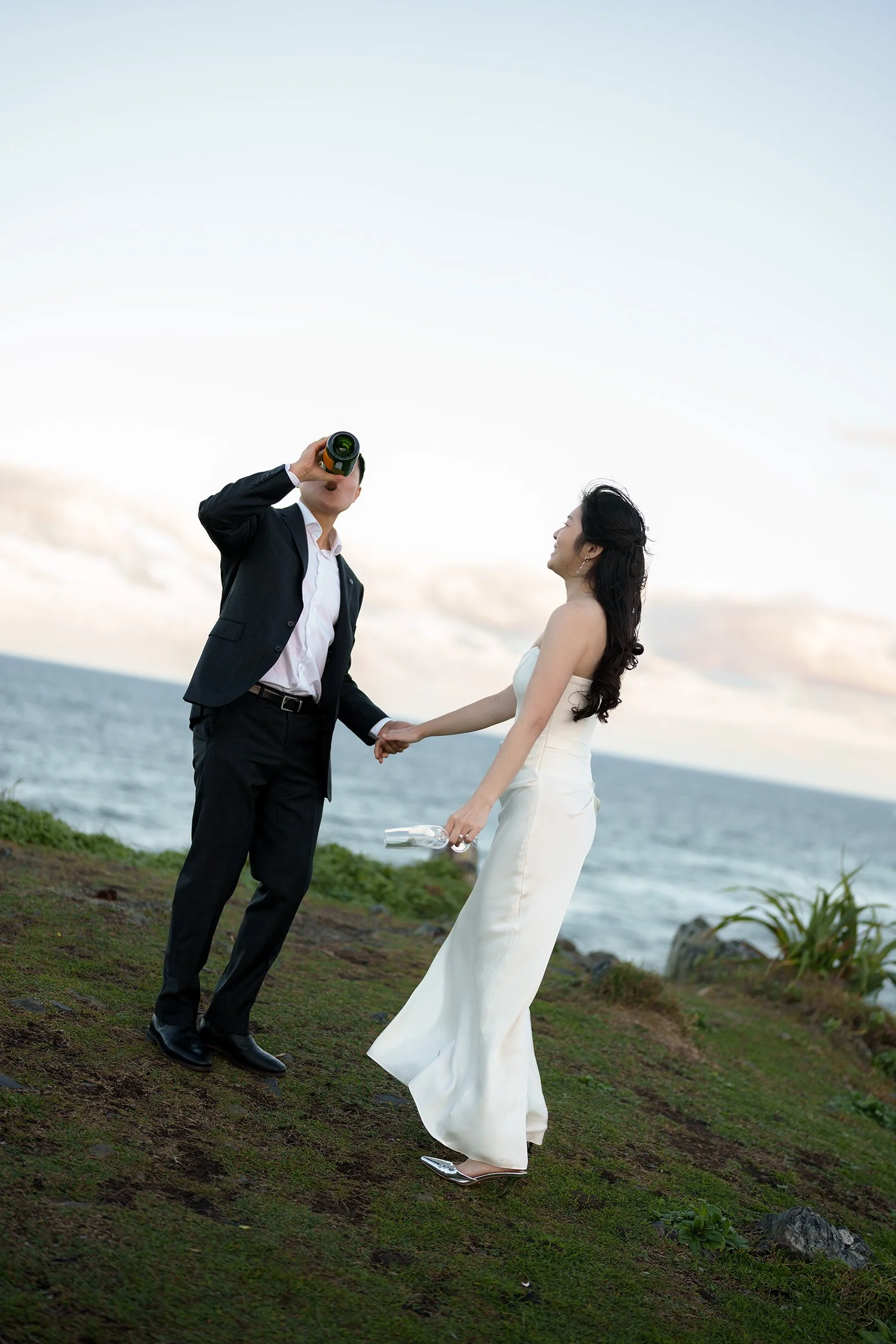 Silva drinking the bottle and the other hand holding Margaret