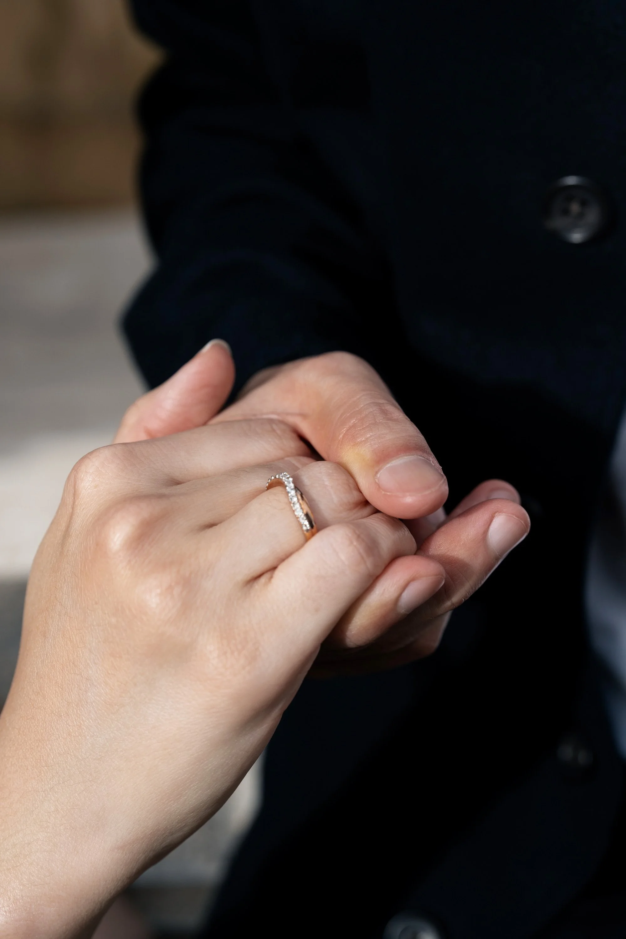 Paul holding Krystel's hand and show their engagement ring to the Brisbane wedding photographer Whistler