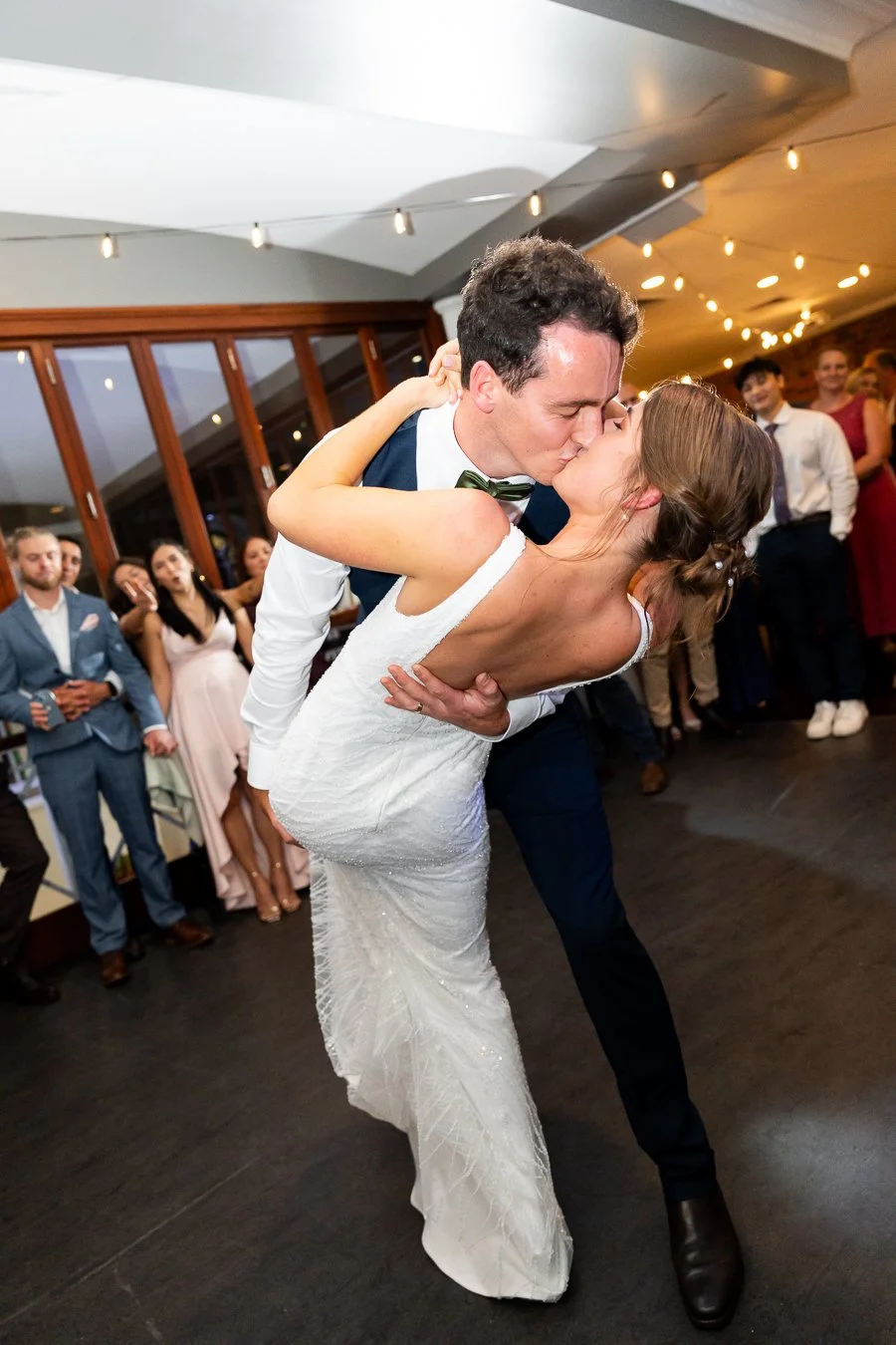 groom Giordan dipping kissing bride Sonya in their first dance