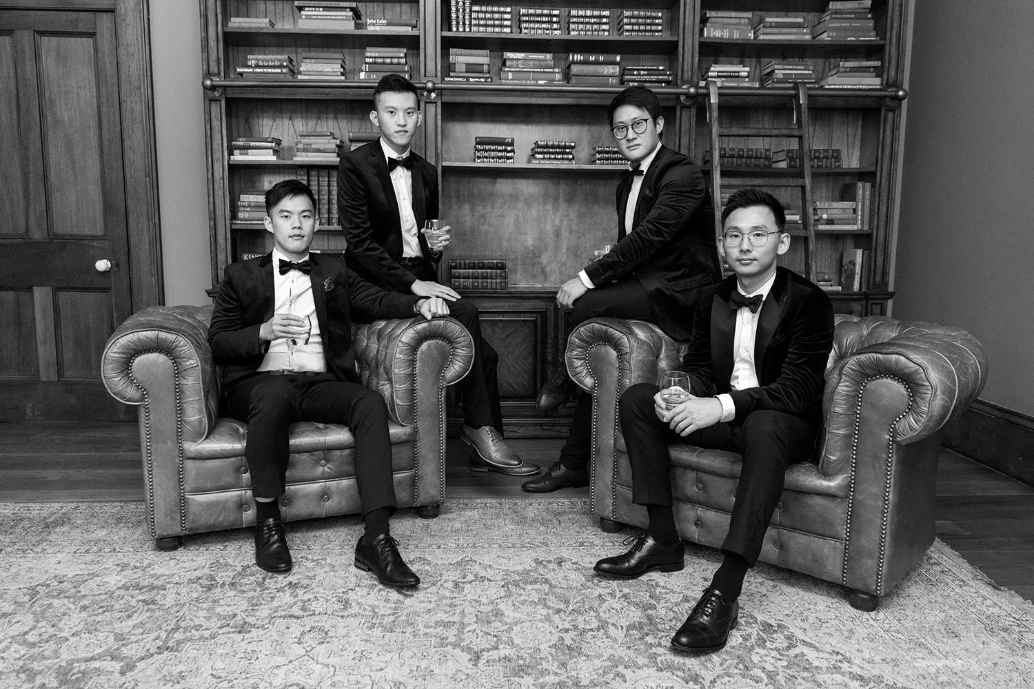 groom Brus with his grooms man look at the Brisbane wedding photographer Whistler in gabbinbar homestead