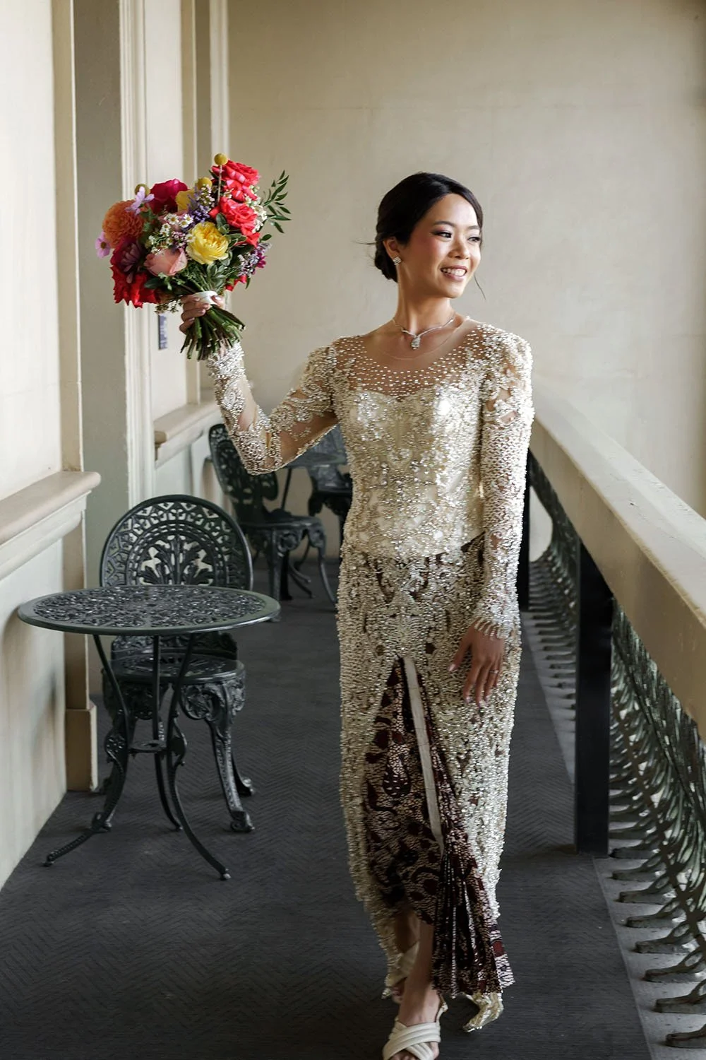 bride Nori raising her flower up while waking