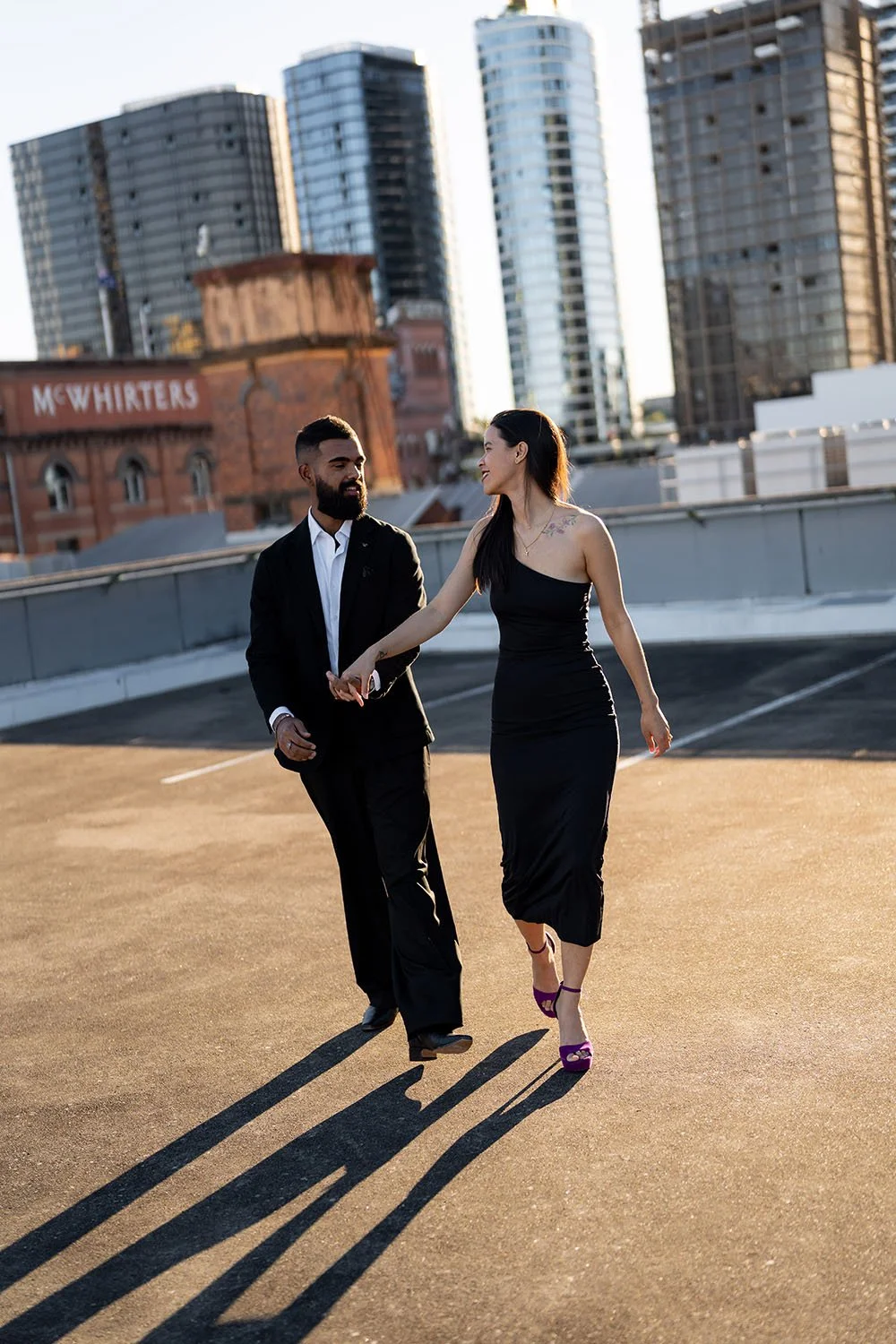 Jasmin and Jay walking together with hands joint