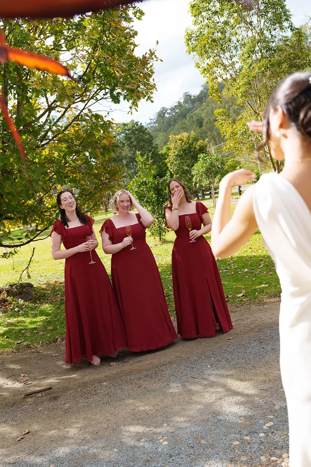 brides mates creaming after see Jasmin in her wedding dress