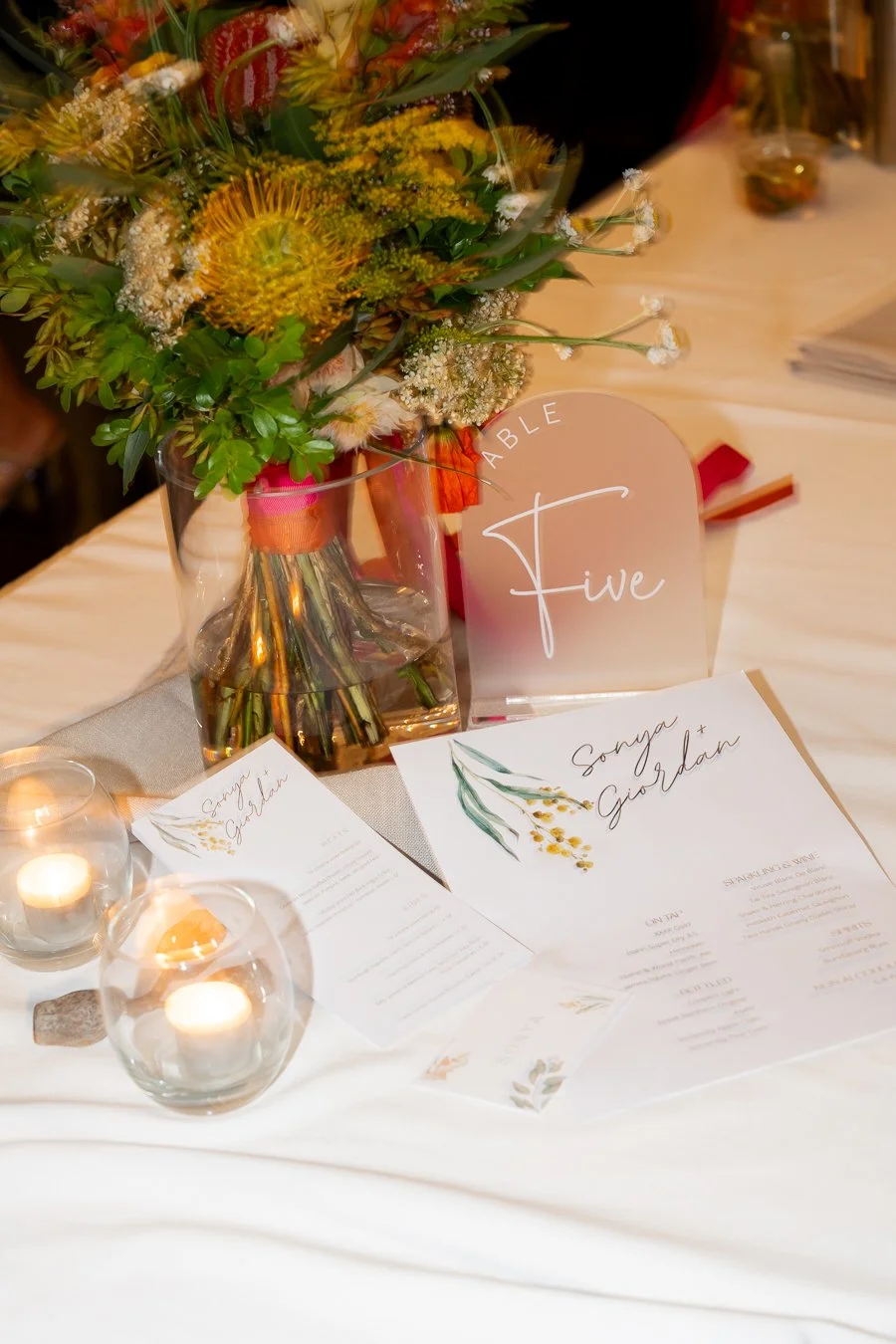 flower and Sonya and Giordan reception menu on table
