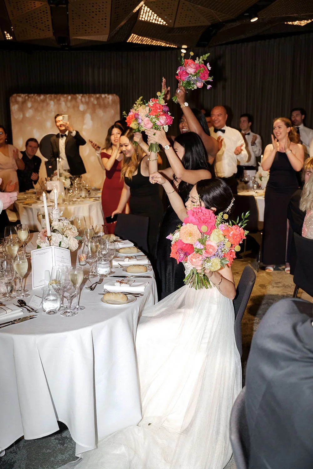 bride Nori keep in high with her bride mates inside reception room in Customs house Brisbane