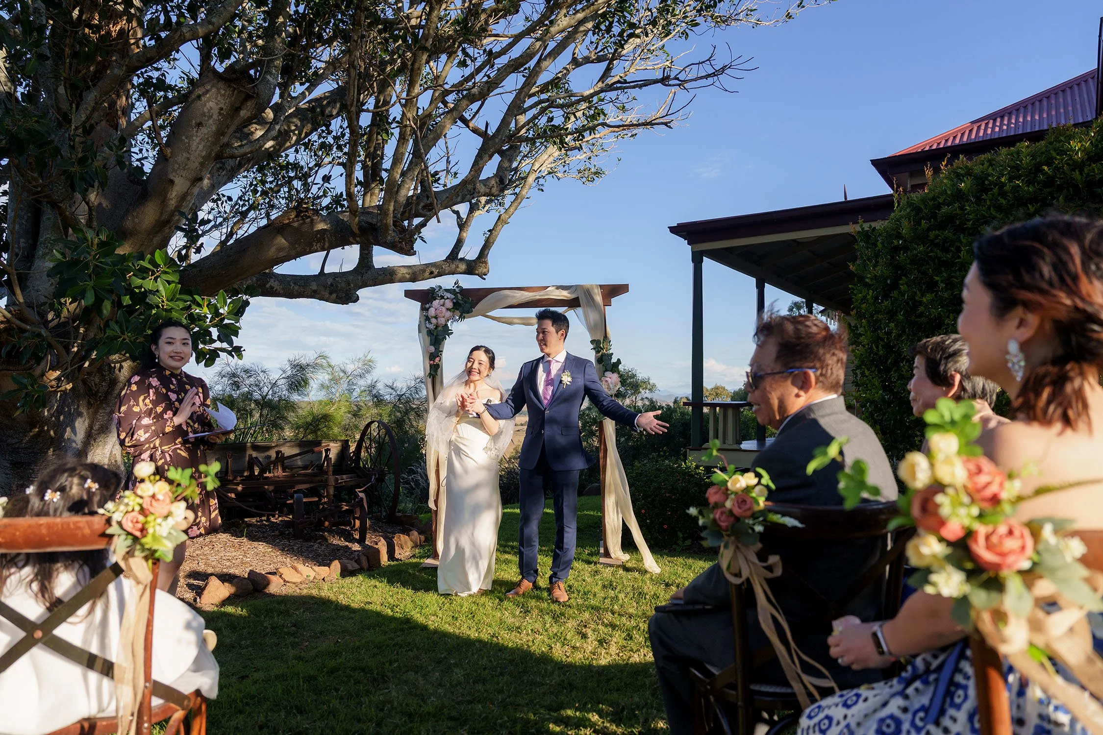 Eric raising arms during the wedding ceremony