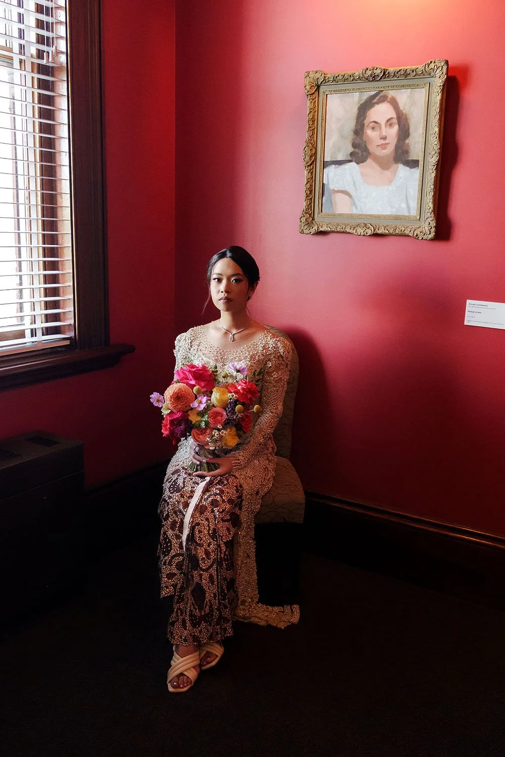 bride Nori sitting on the chair and next to the window light and look Whistler li