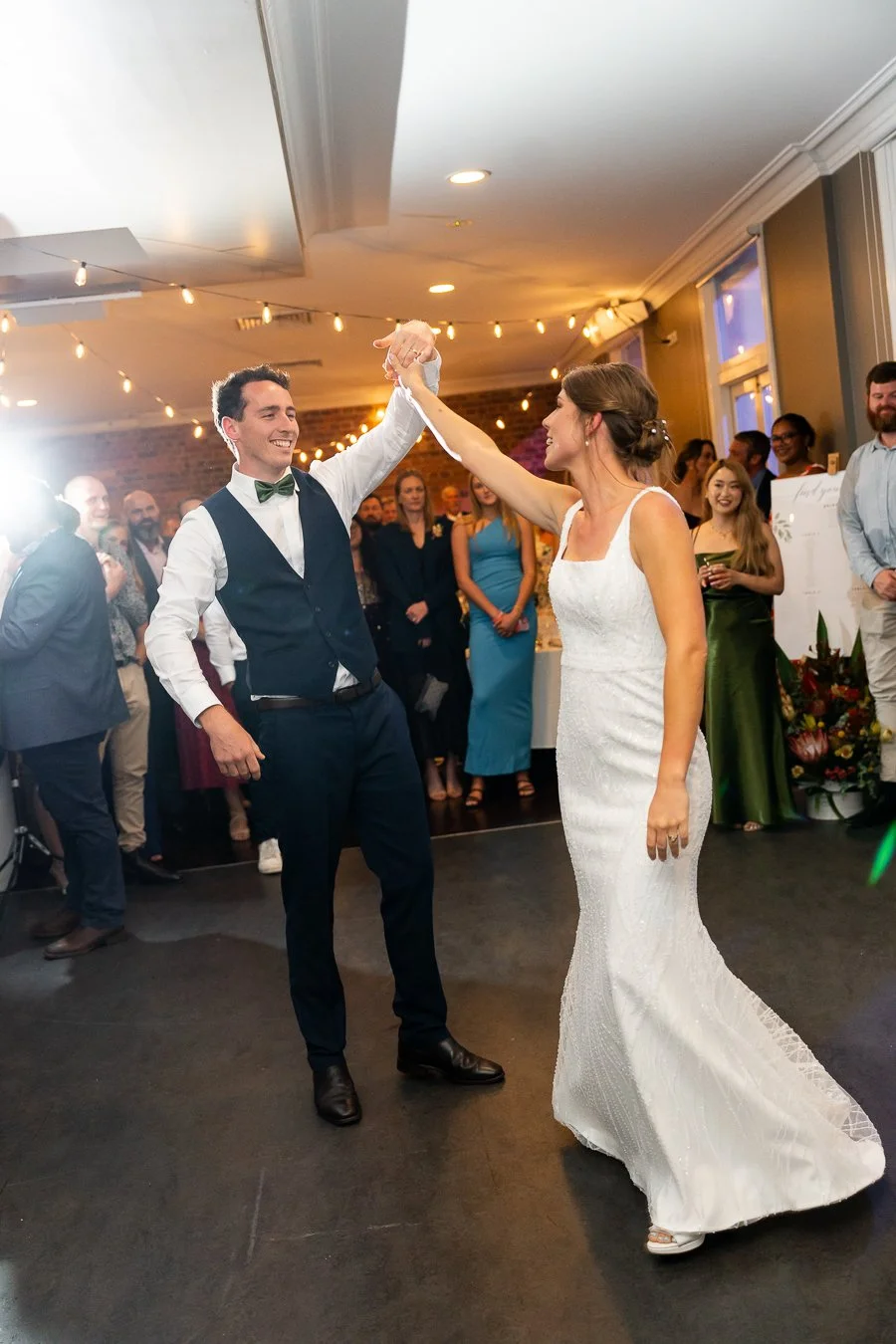 groom Giordan make bride Sonya a spinning in their first dance in reception room in transcontinental hotel