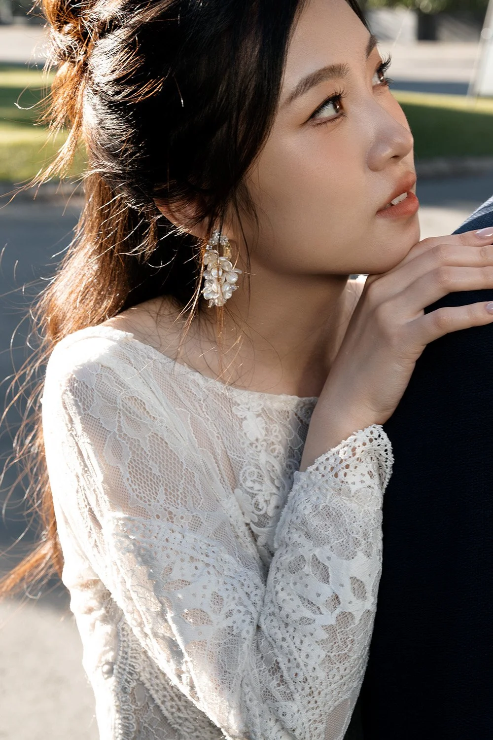 bride Cassie relax on Leo's shoulder and look up to him
