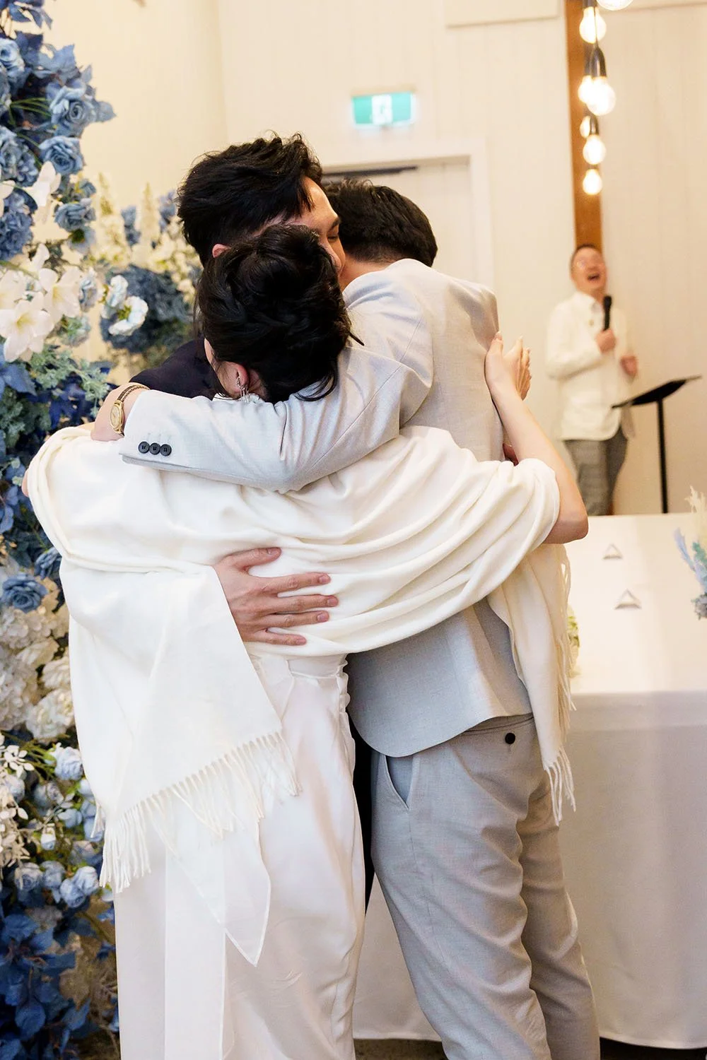 Lisa, Michael hugging her little brother and MC laughing at the background