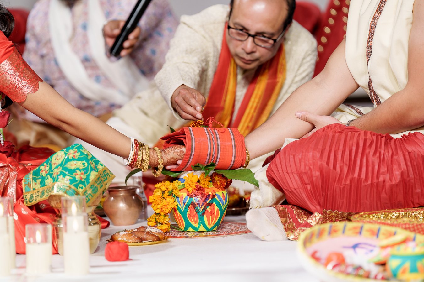 Amrita's uncle put on the rice to their red cloth