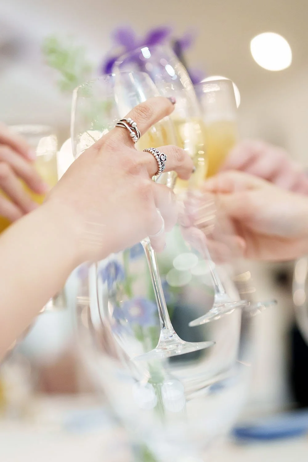 wine glass up to the ear and together