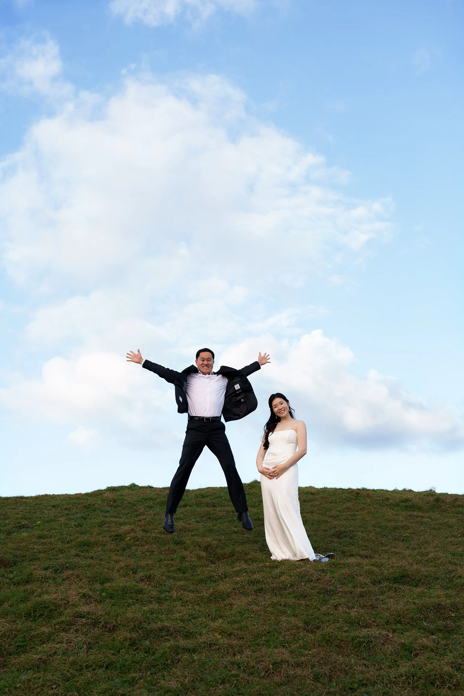 Silva jumping and Margaret stand next to him