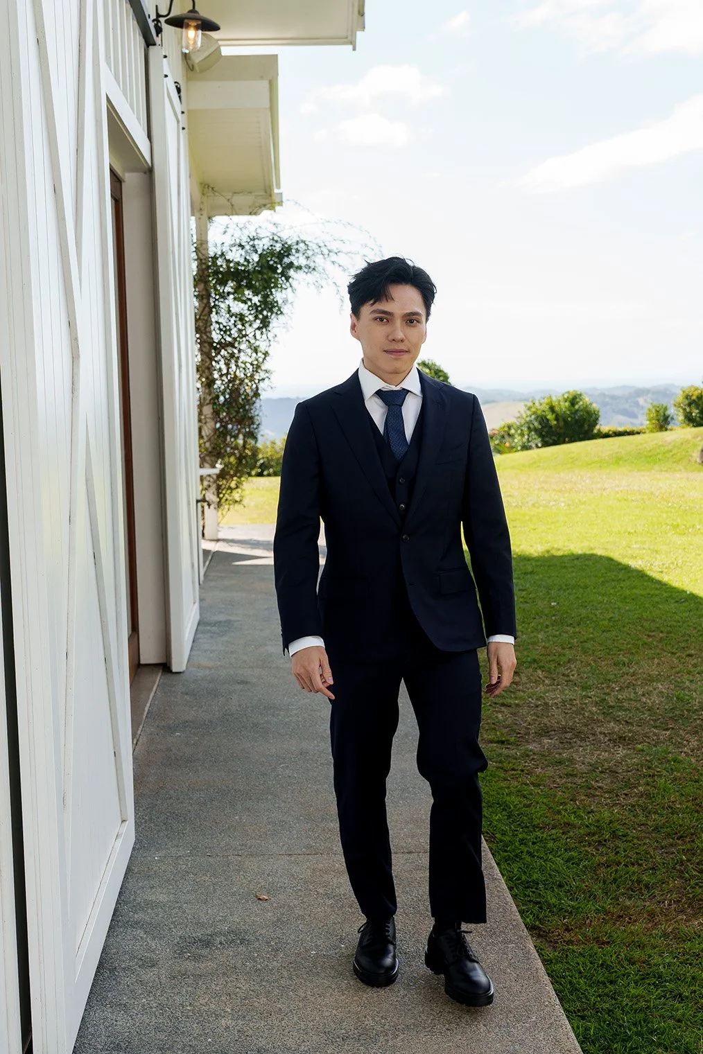 Michael look at the Brisbane wedding photographer Whistler Li while walking to him