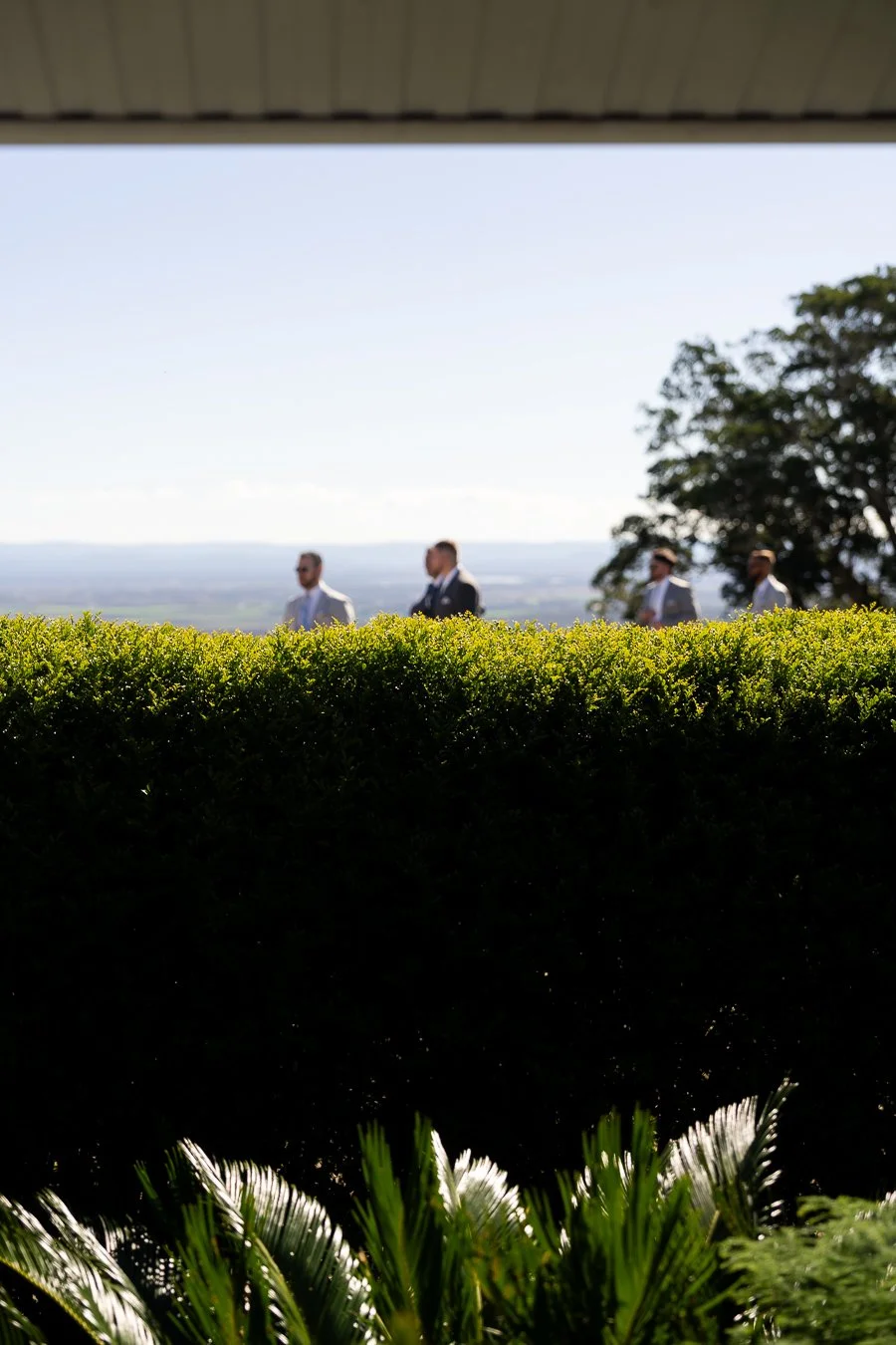 Ben and his groomsmen walking pass