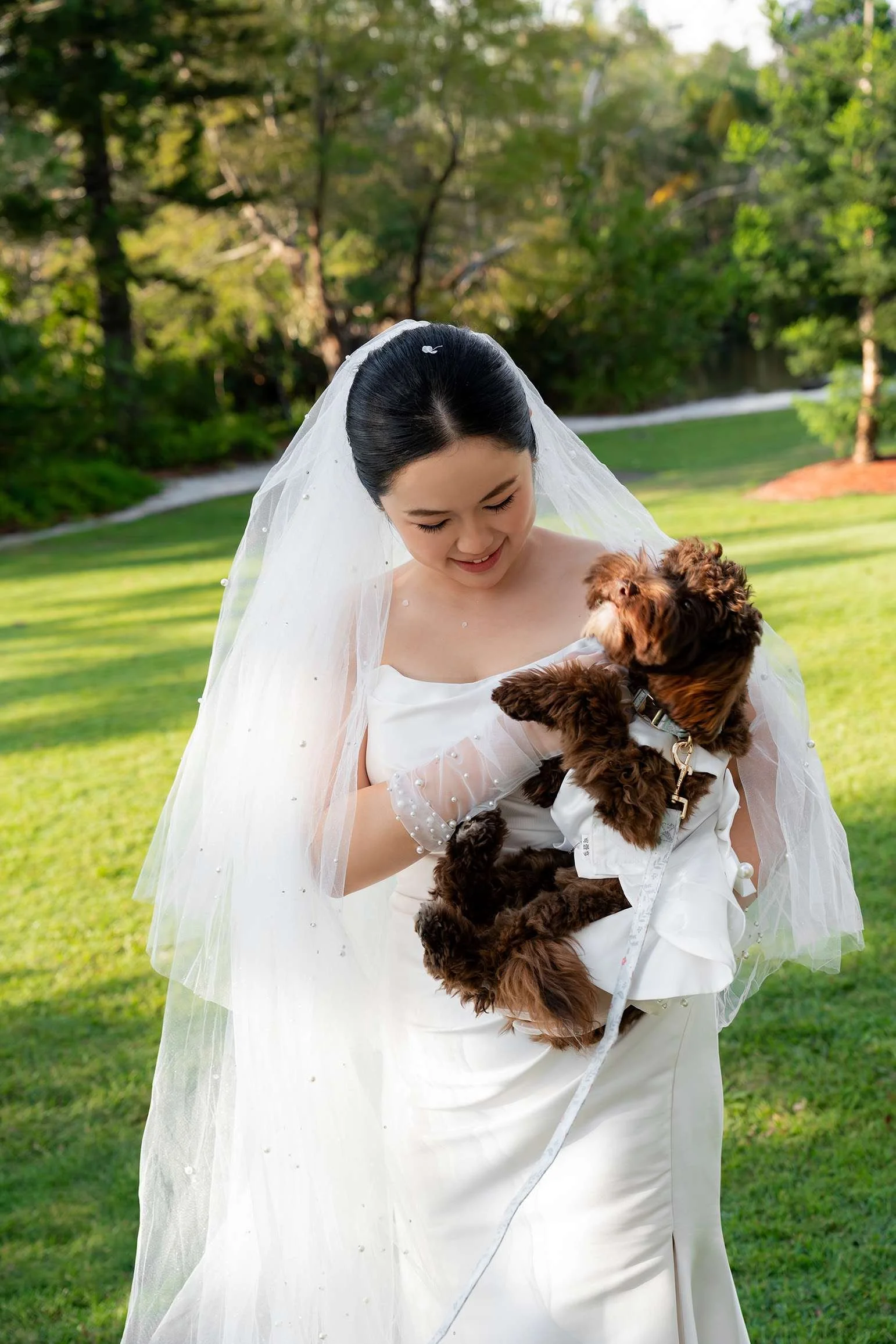 bride Wendy holding up her dog