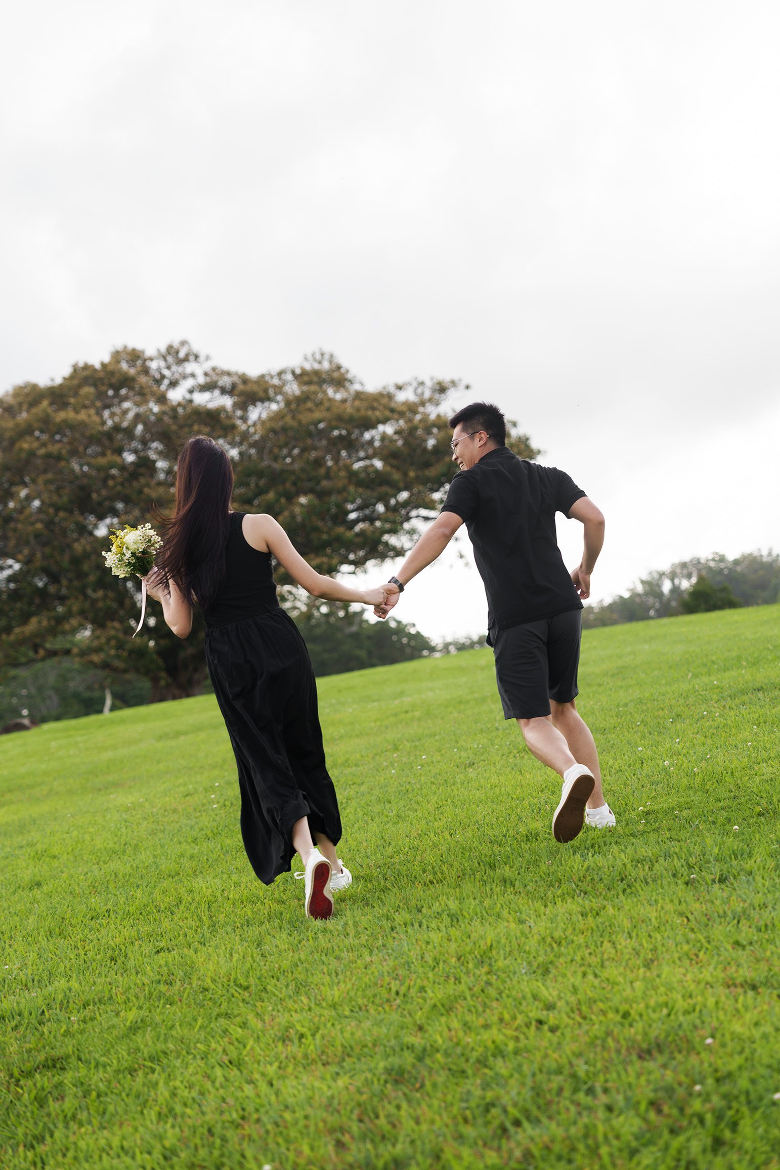 Brain and Rennie holding hands running
