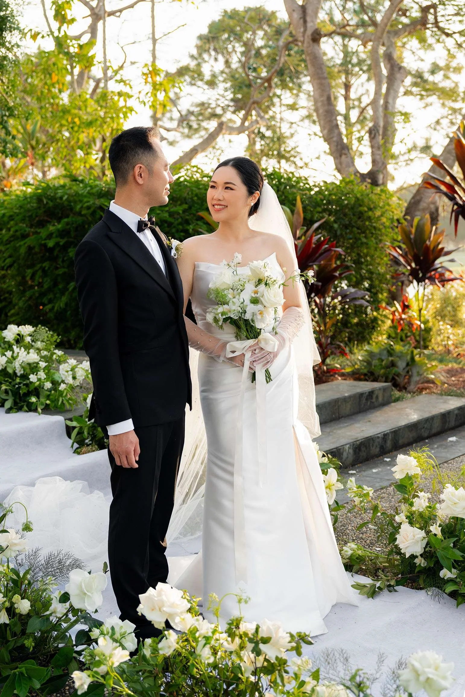 bride Wendy look at groom Alex with smell when two hands holding the flower