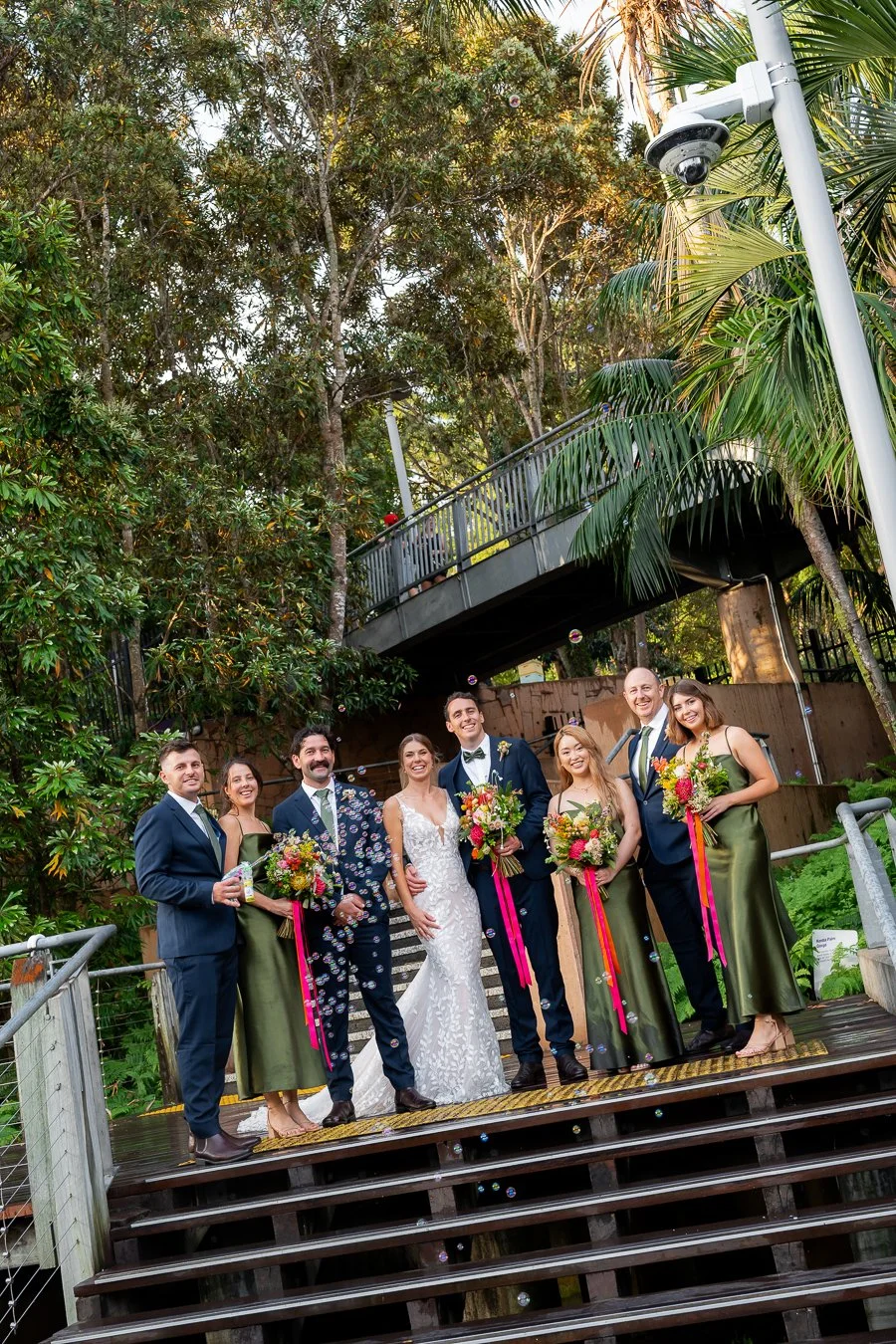 Sonya and Giordan's bridal party with bubble gun machine fire