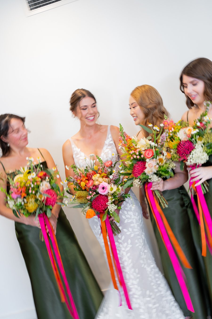 The bride with her bridesmaids a joyful smile