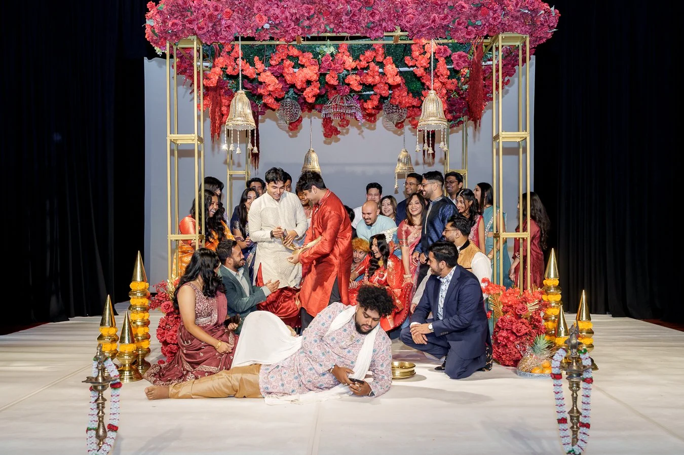 two males stealing the groom’s shoes