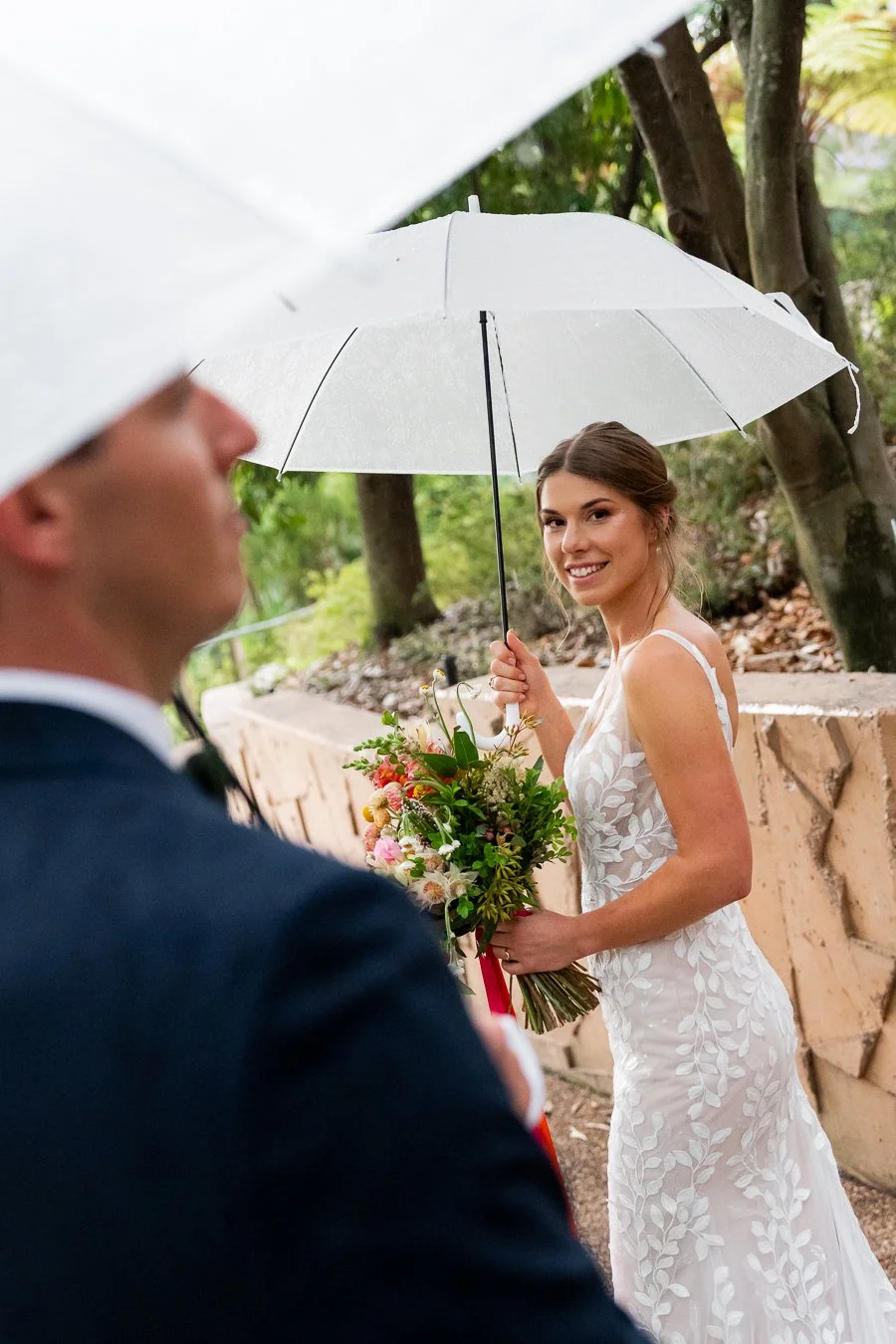 bride Sonya look at the Brisbane wedding photographer Whistler Li and groom Gordon look away