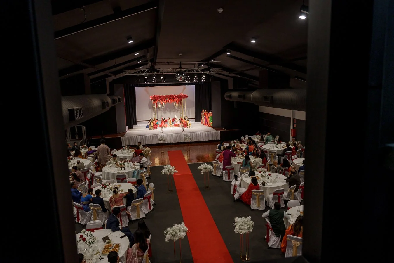 through a window to see Amrita and Casey's mandap celebration