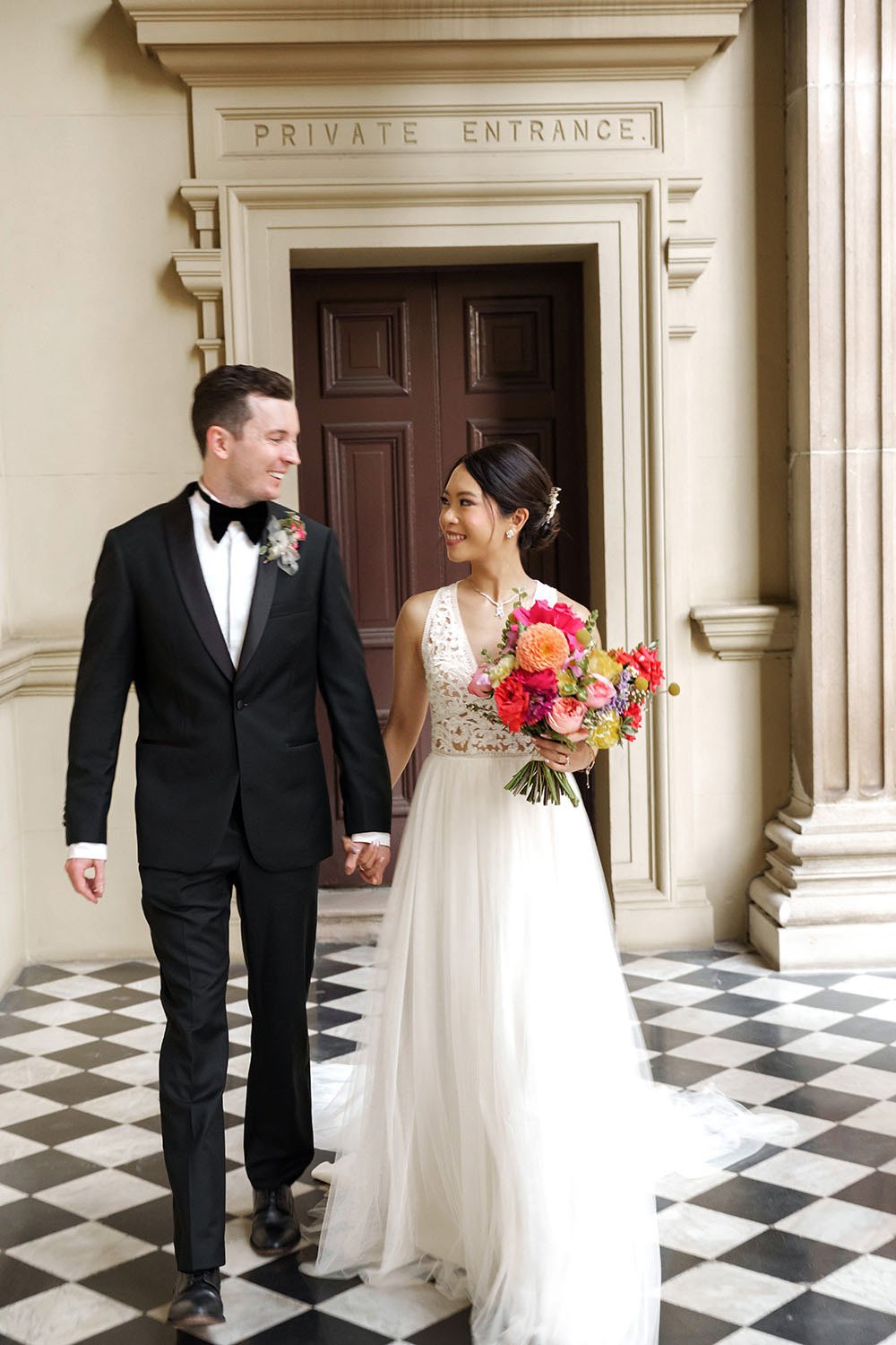 Nori and Cliffe holding hands walking together