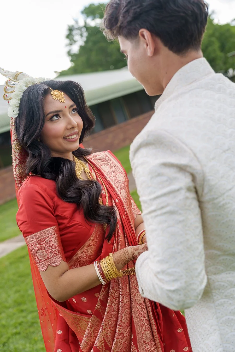 Amrita look to Casey while holding hands together