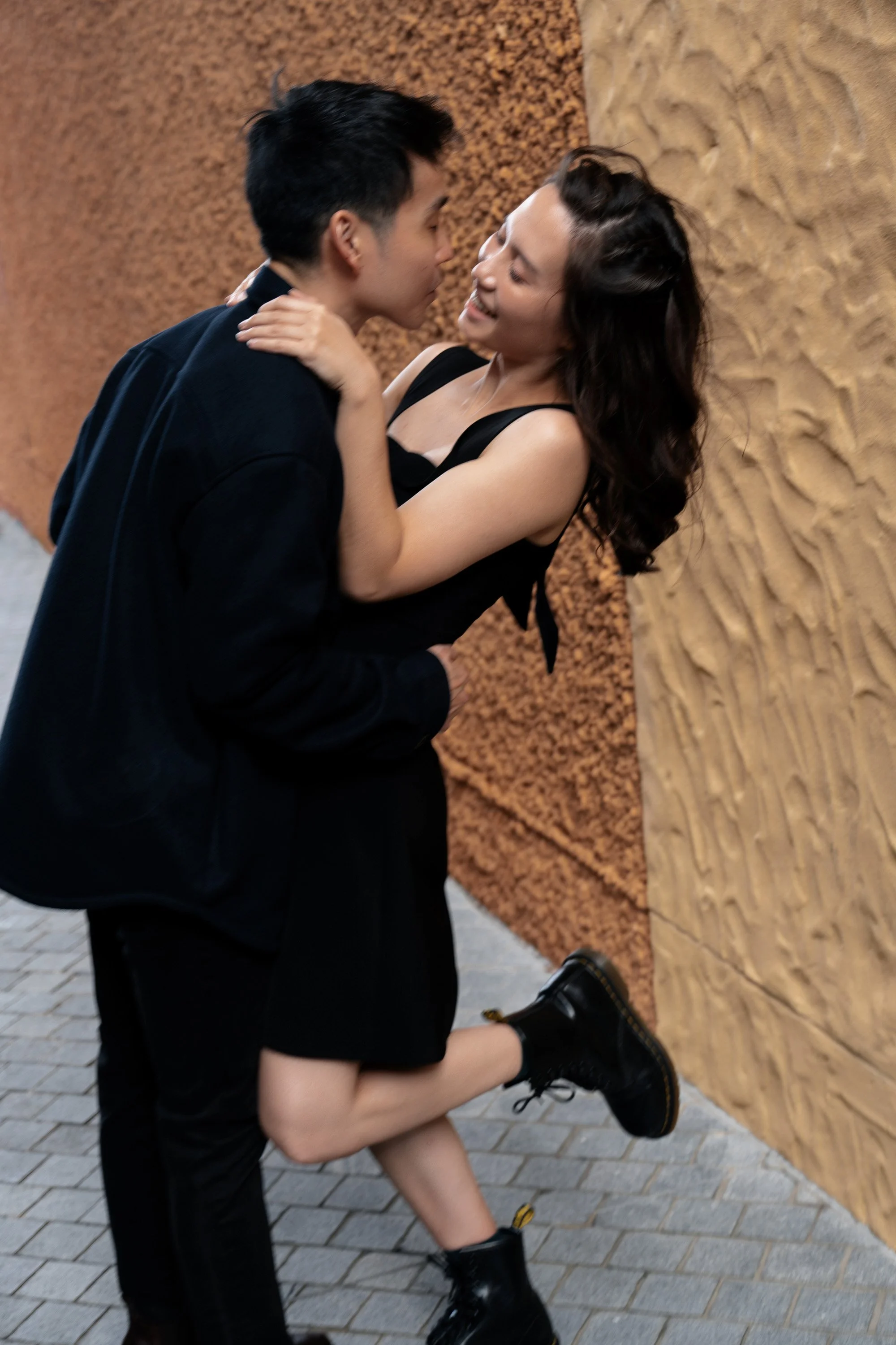 Paul try to kiss Krystel in Emerald Lakes Village, Brisbane engagement photography