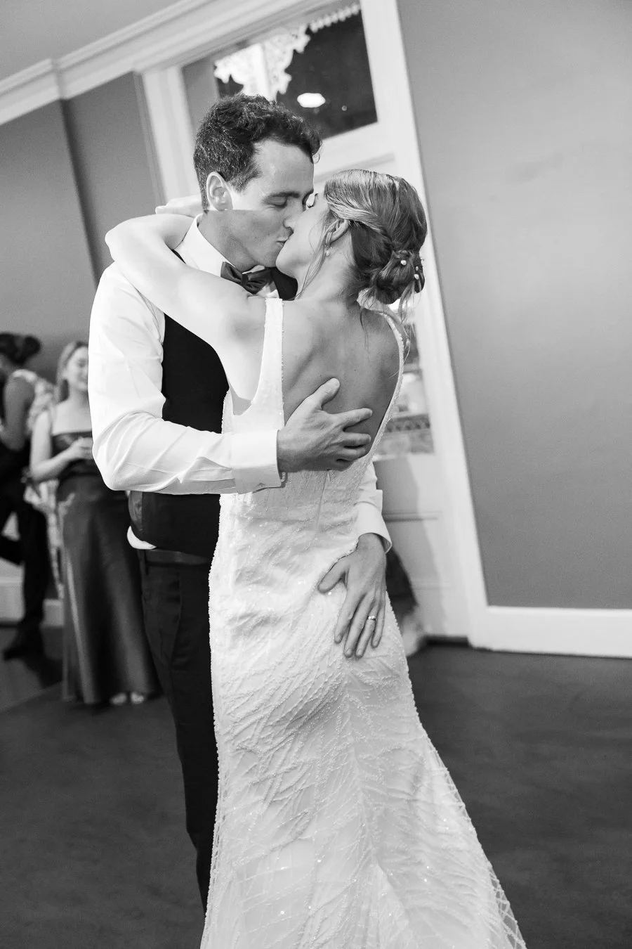 bride and groom kissing in their first dance