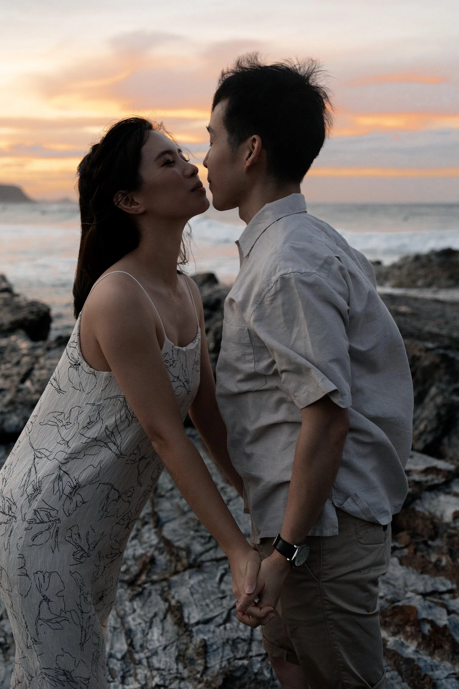 Krystel try to kiss Paul when they holding hands, Brisbane engagement photography