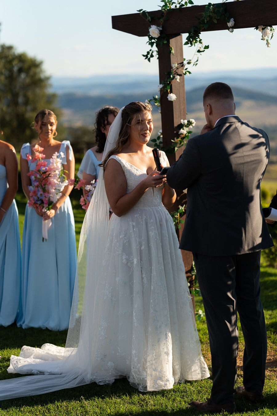 bride Chiarra look at groom Ben and groom cry