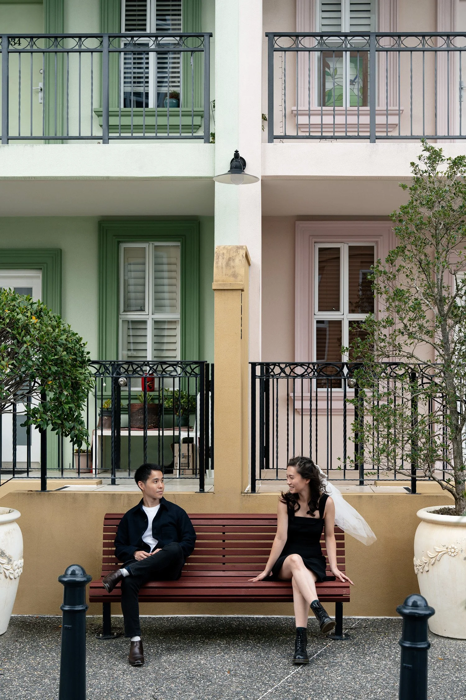 Paul and Krystel sitting on the bench in Emerald Lakes Village