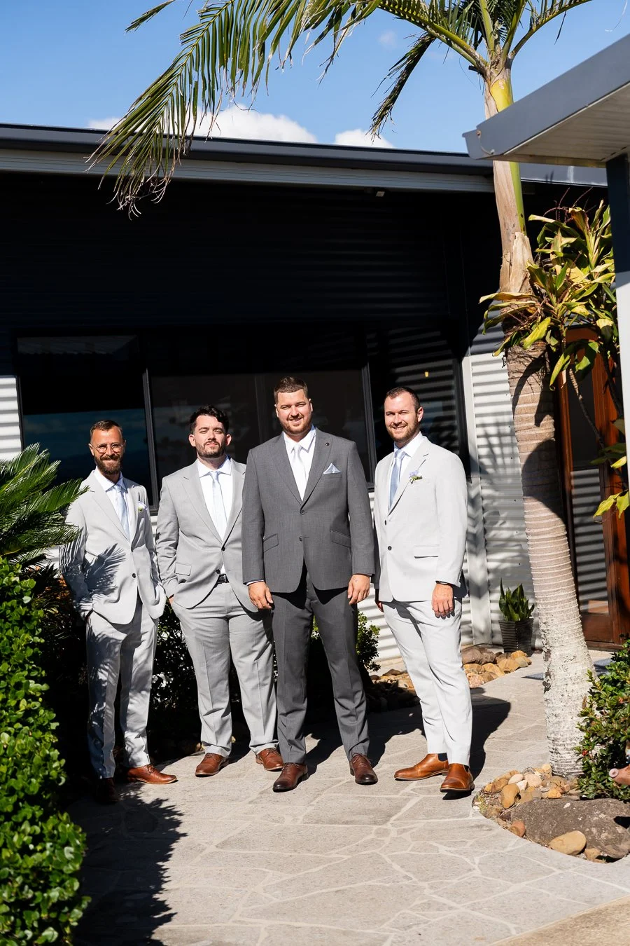 Ben and his groomsman look to the Brisbane wedding photographer Whistler Li